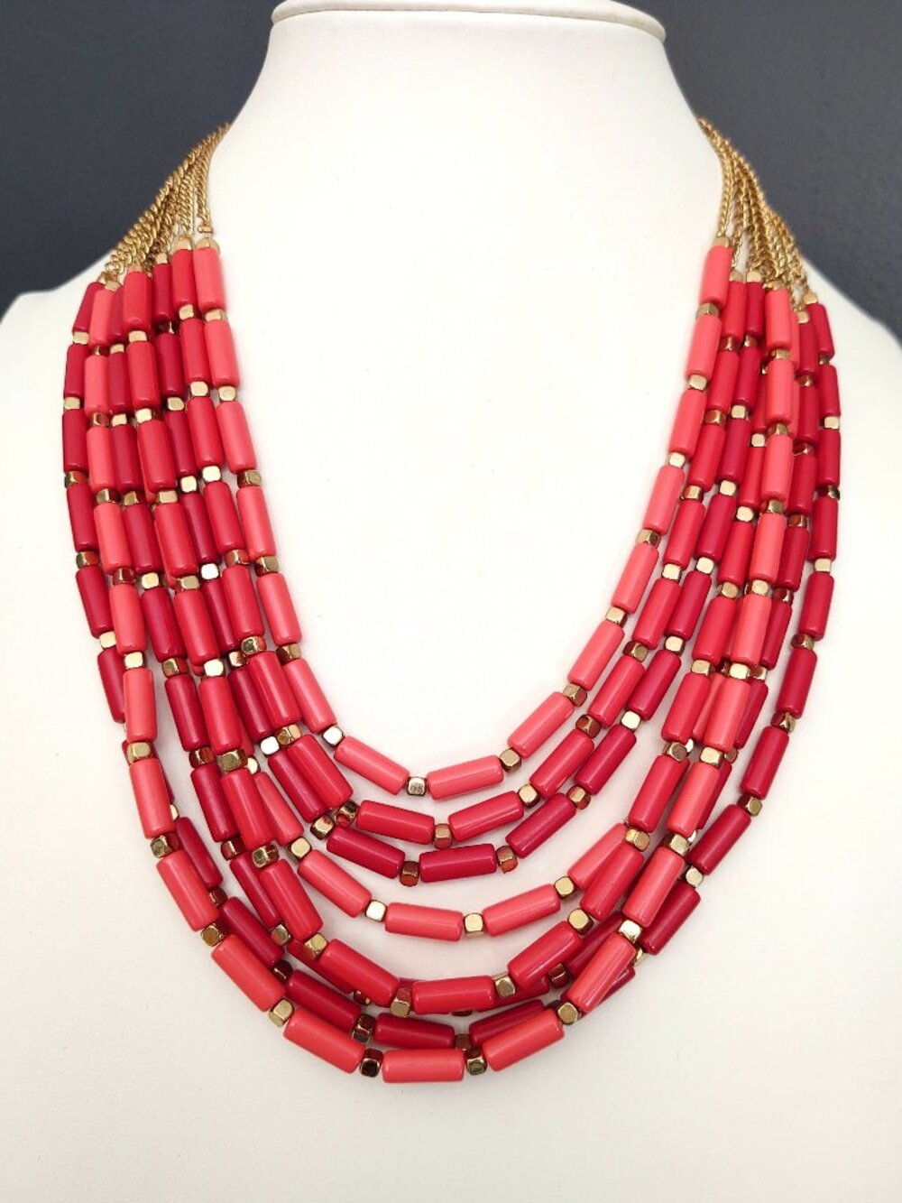Red, salmon & orange-red tubular beaded multi strand necklace with gold accents